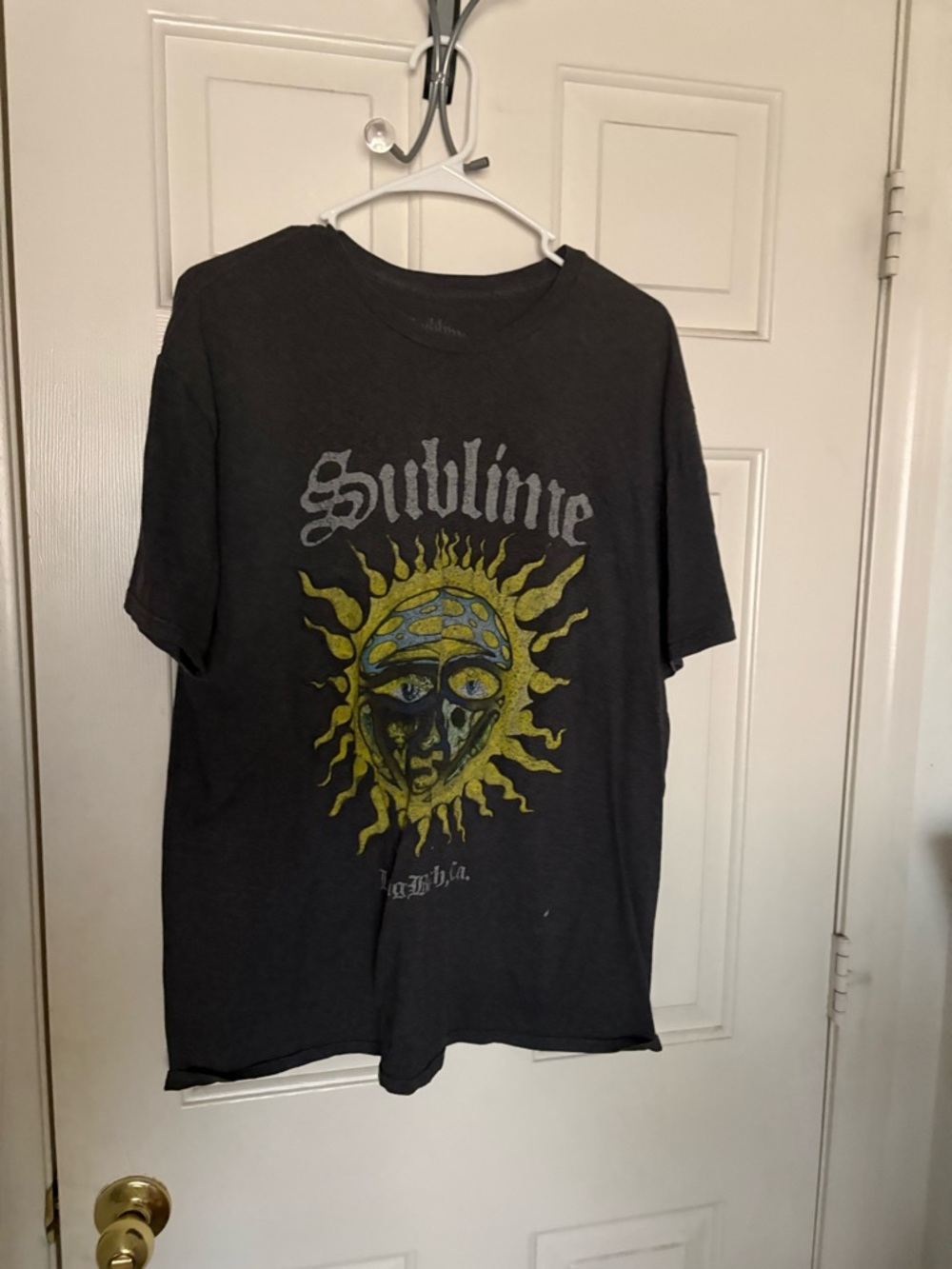 Sublime Black Short-Sleeve Graphic Tee with Yellow Sun Motif